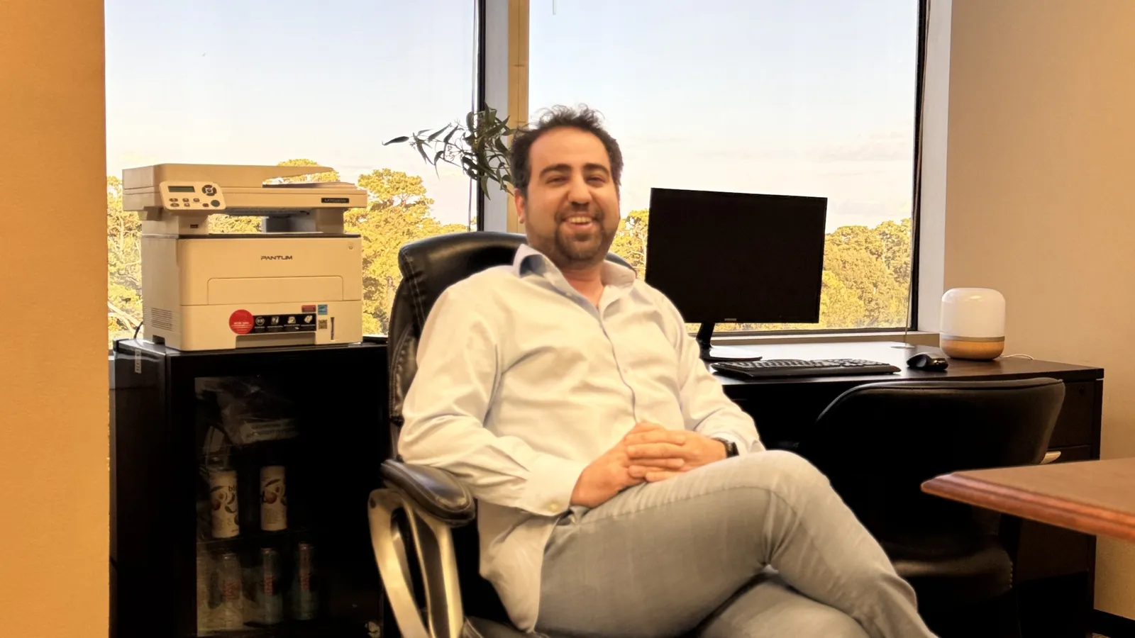 Dr. Medai Abadi, founder of Medai Digital, in his Houston office